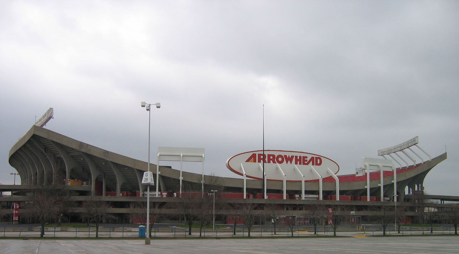 Exterior view of Arrowhead Stadium in Kansas City, Missouri, with the large 'ARROWHEAD' sign
