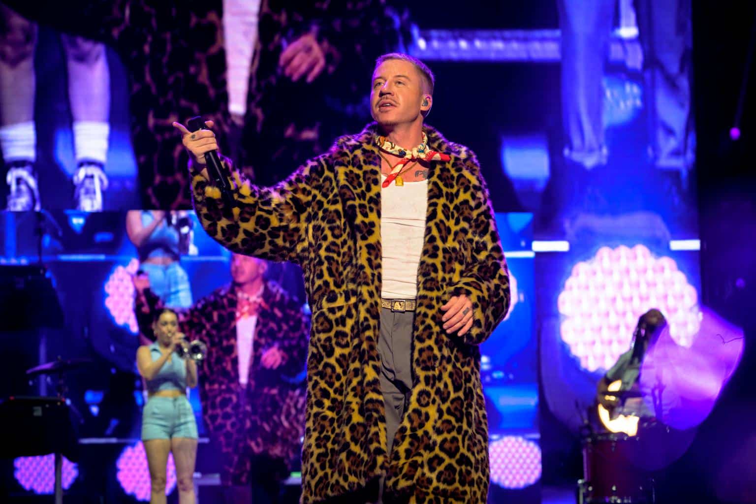 Macklemore performing on stage