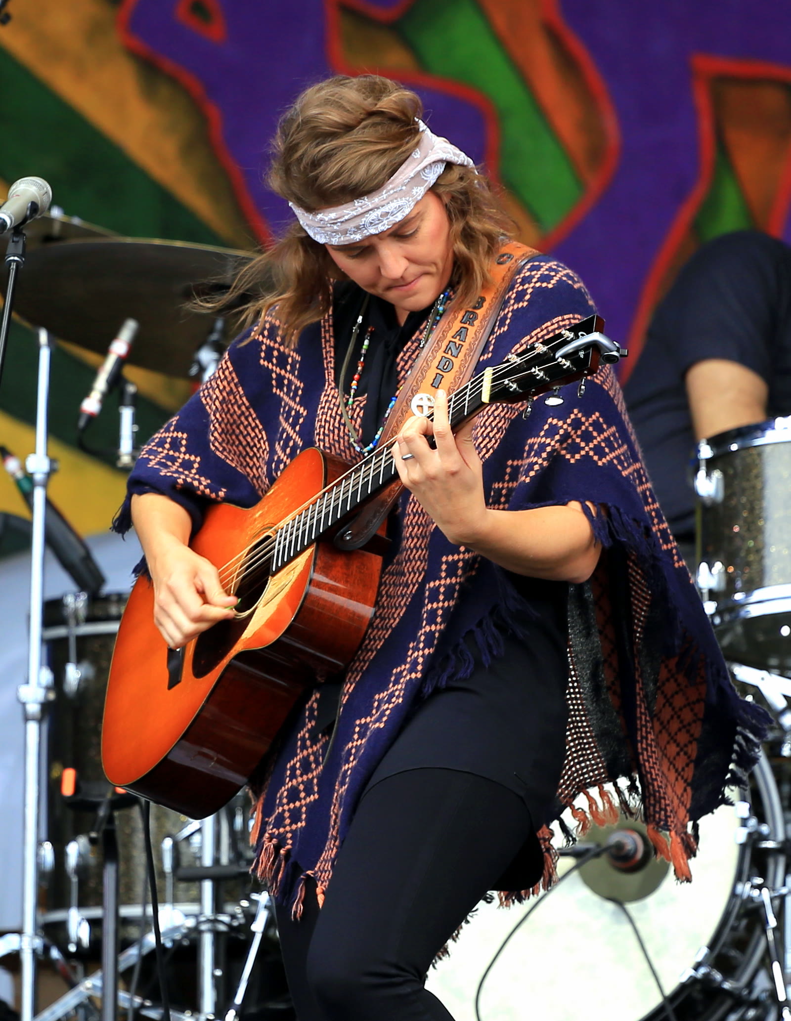 Brandi Carlile playing acoustic guitar at the 2016 New Orleans Jazz and Heritage Festival
