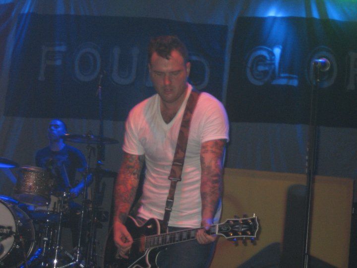 Chad Gilbert performing live on stage with New Found Glory