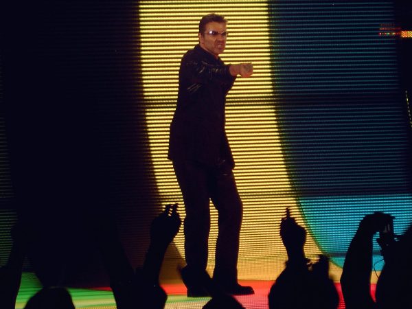 George Michael performing on stage during a concert