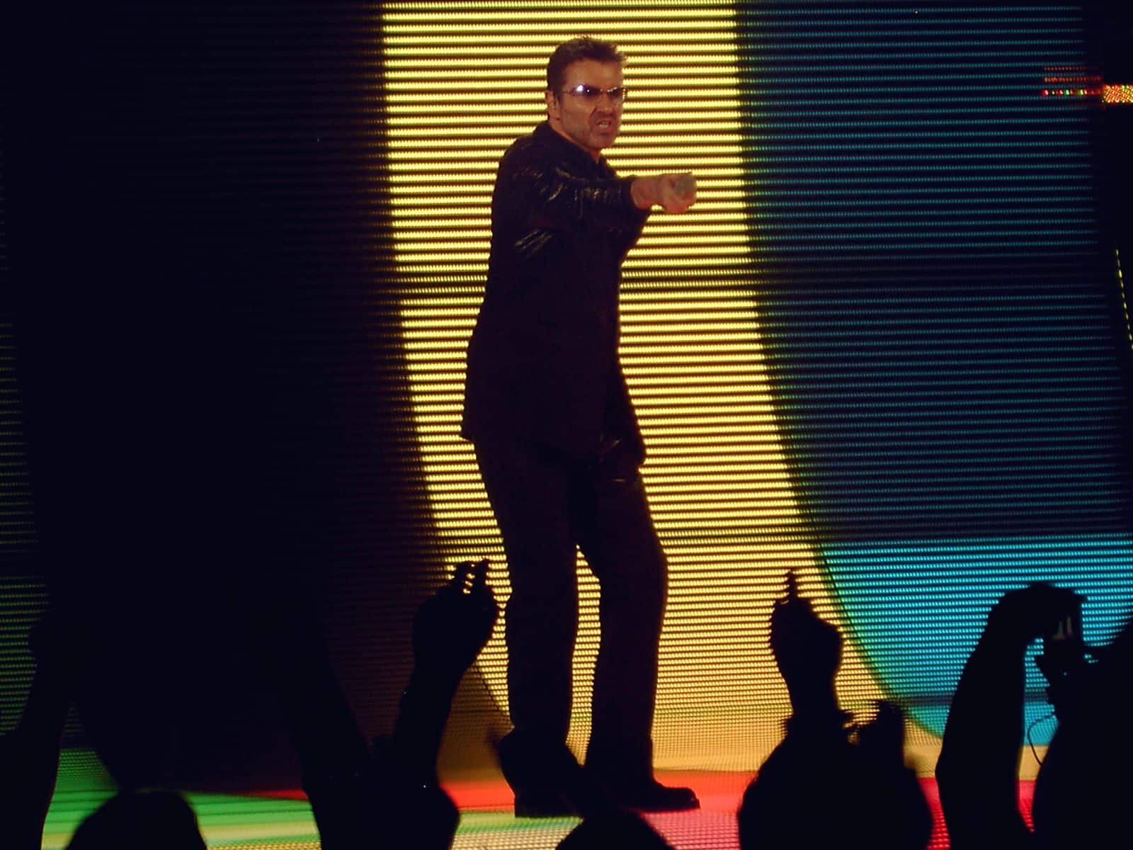 George Michael performing on stage during a concert