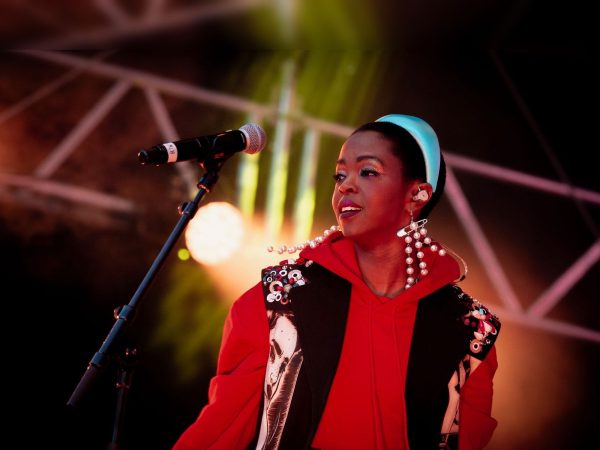 Ms. Lauryn Hill performing on stage, set to headline the canceled 2026 Global Citizen Festival