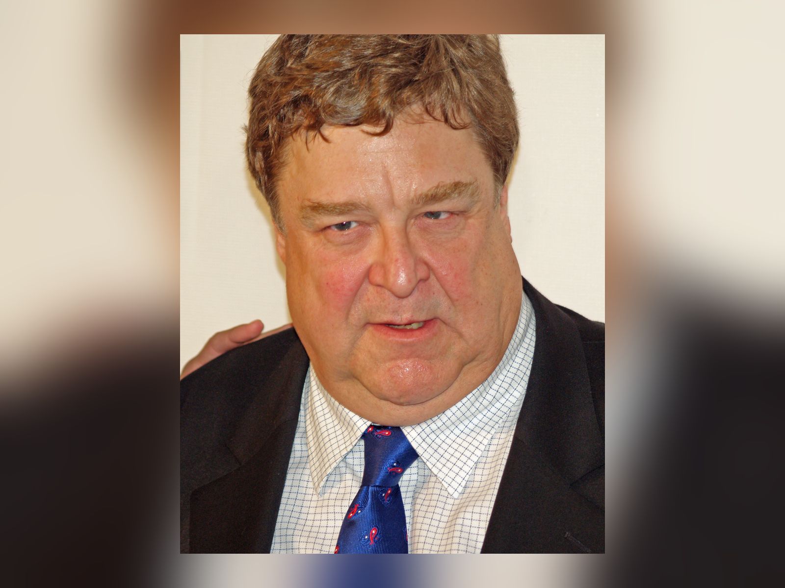 John Goodman smiling in a suit at the Speed Racer premiere at the 2008 Tribeca Film Festival