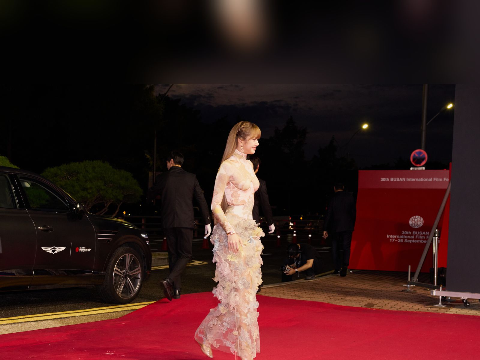 BLACKPINK's Lisa at the 2025 Busan International Film Festival; she trained over 5 years in the K-pop trainee system before debuting