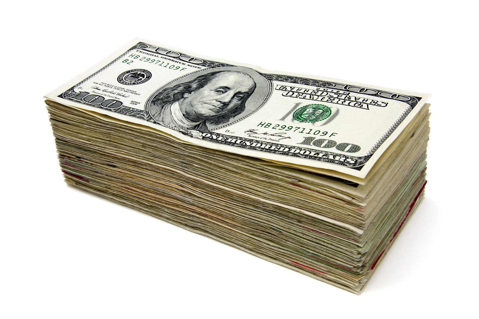 Stack of hundred-dollar bills illustrating how celebrity net worth is calculated from cash and assets