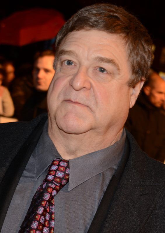John Goodman in a suit and tie at a 2014 event