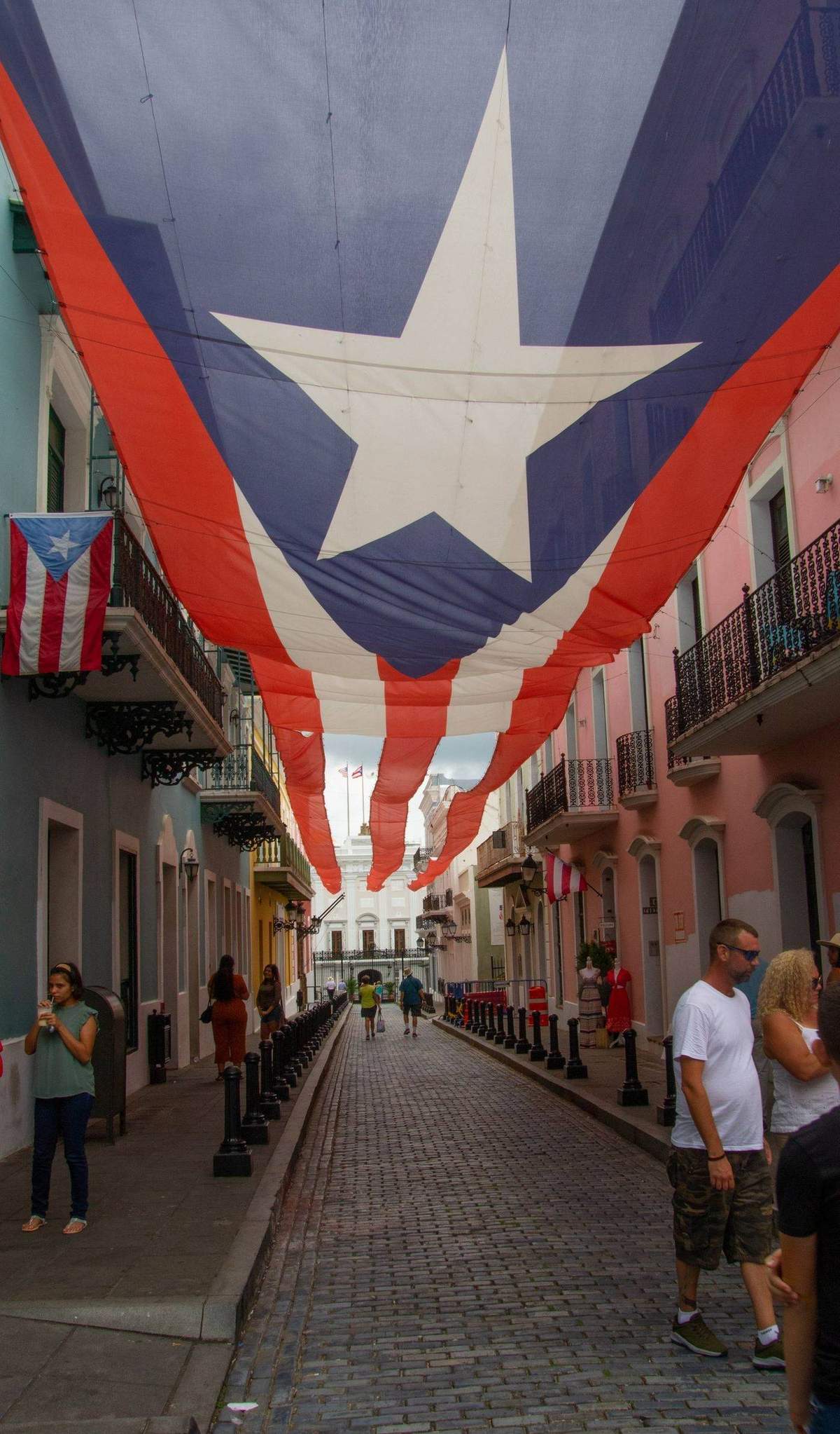 Puerto Rican flag flying over Calle La Fortaleza in Old San Juan, where the Ironmouse VTuber biography begins