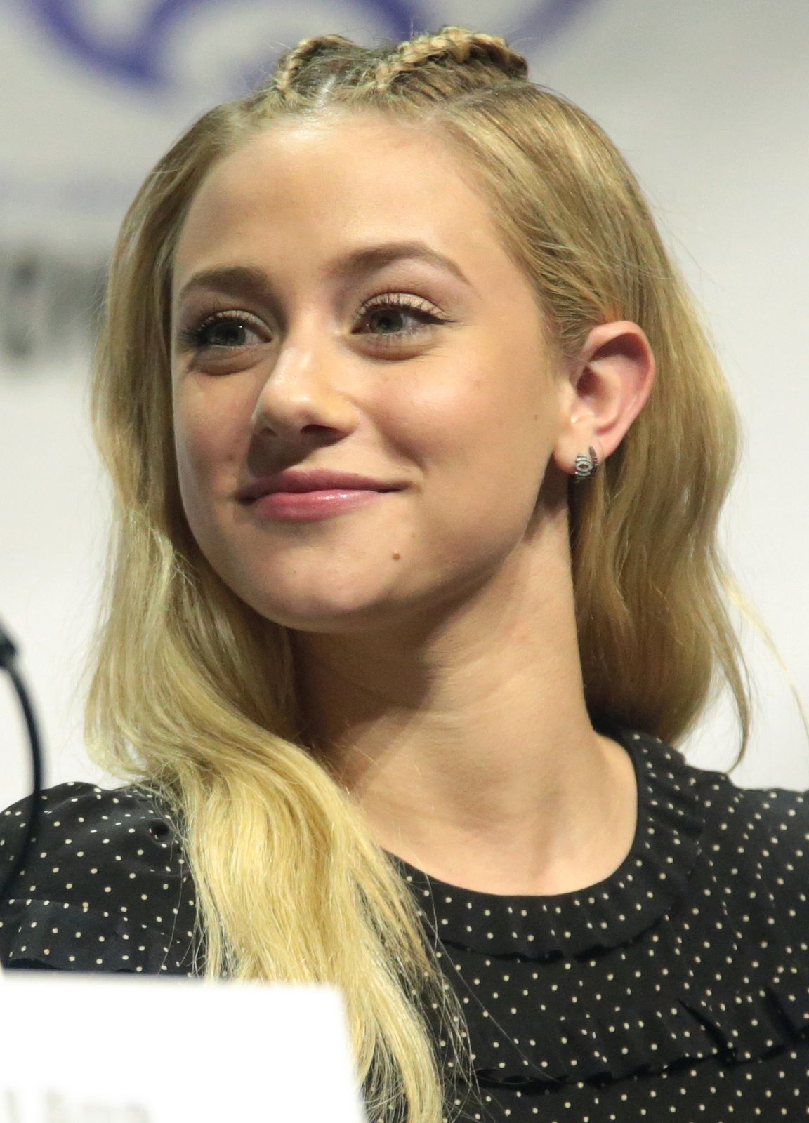 Lili Reinhart speaking on stage at WonderCon 2017 in Anaheim, California.