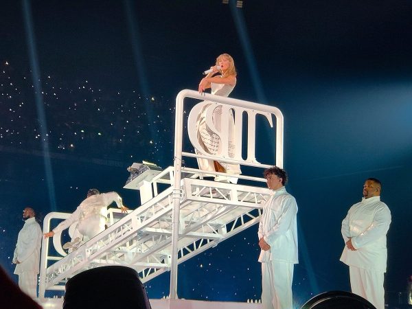 Taylor Swift performing on stage during the Eras Tour in Paris