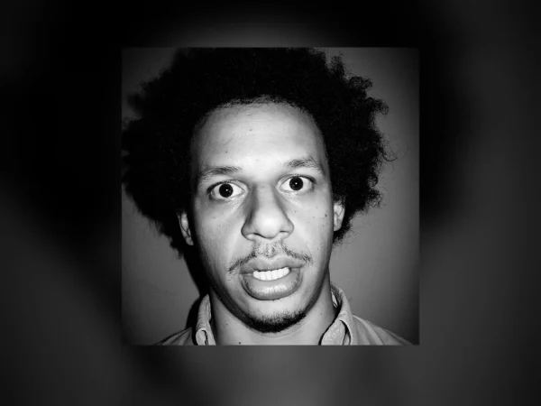 Eric André portrait — black and white headshot of the comedian facing the camera