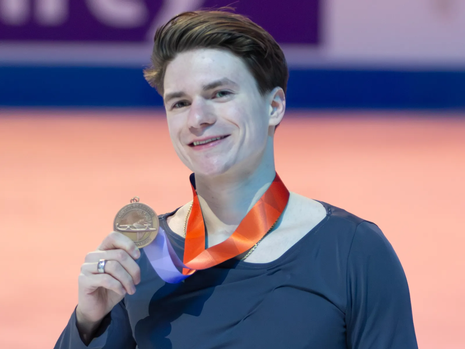 Maxim Naumov smiling with his medal at the 2026 U.S. Figure Skating Championships