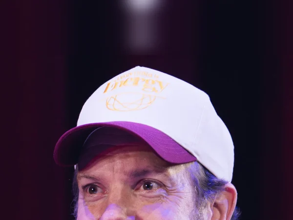 Jason Sudeikis, the star and co-creator of Ted Lasso, wearing a cap at a live event