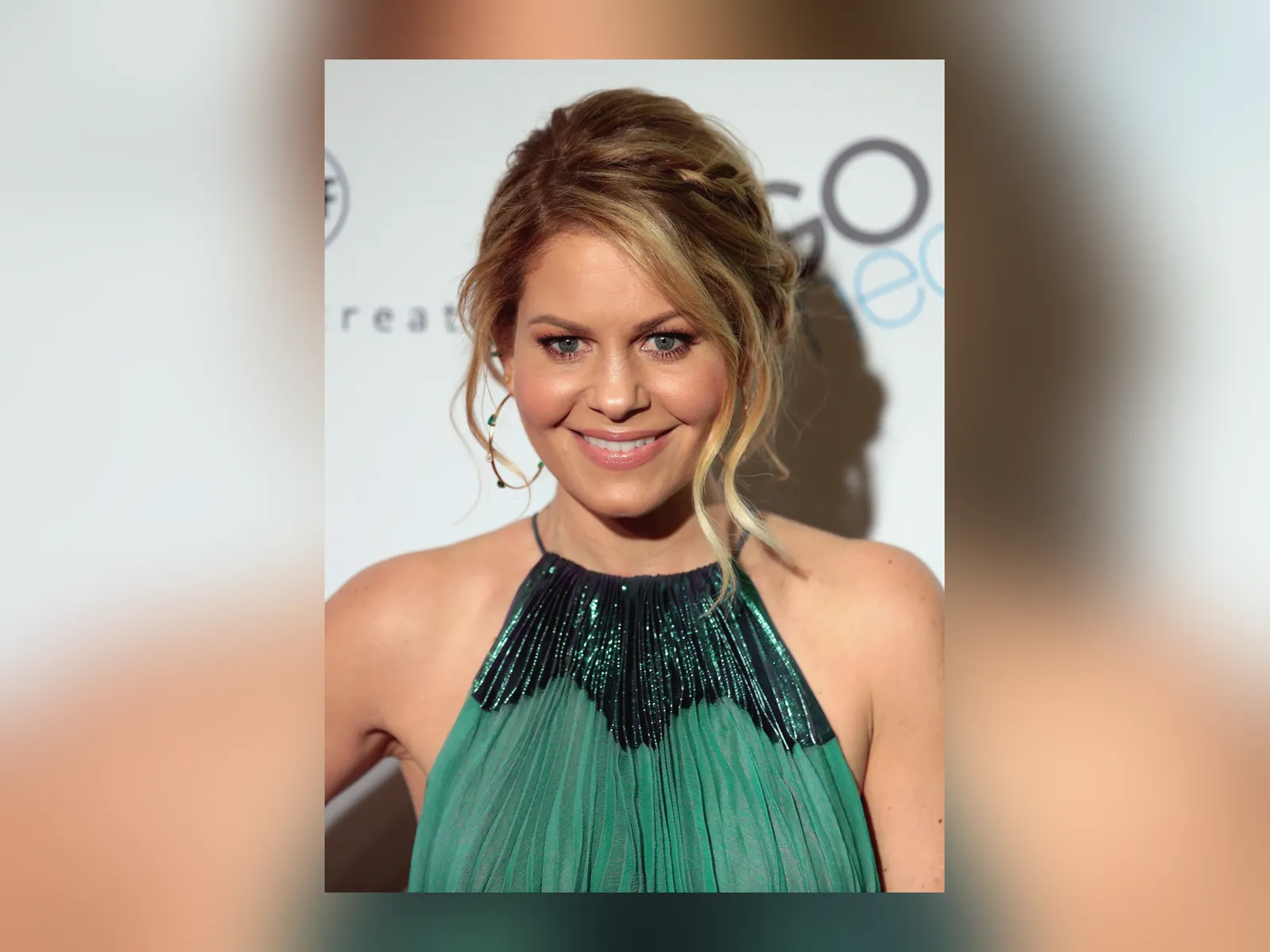 Candace Cameron Bure smiling on the red carpet