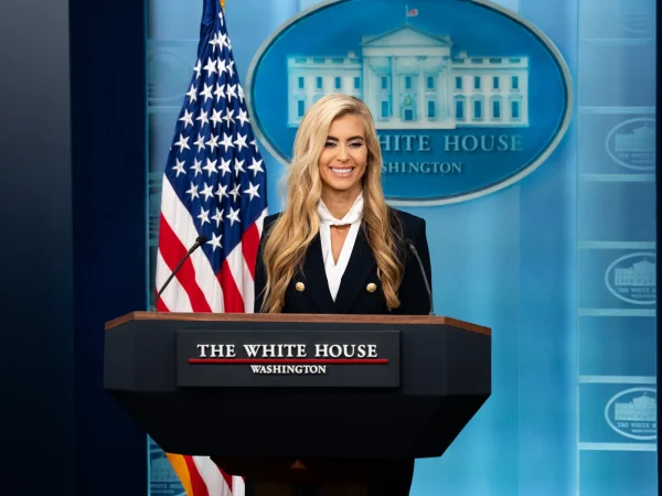 Katie Zacharia at the podium during her first White House press briefing on October 13, 2026