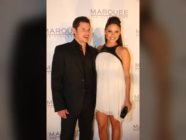 Love Is Blind hosts Nick Lachey and Vanessa Lachey posing together at an event