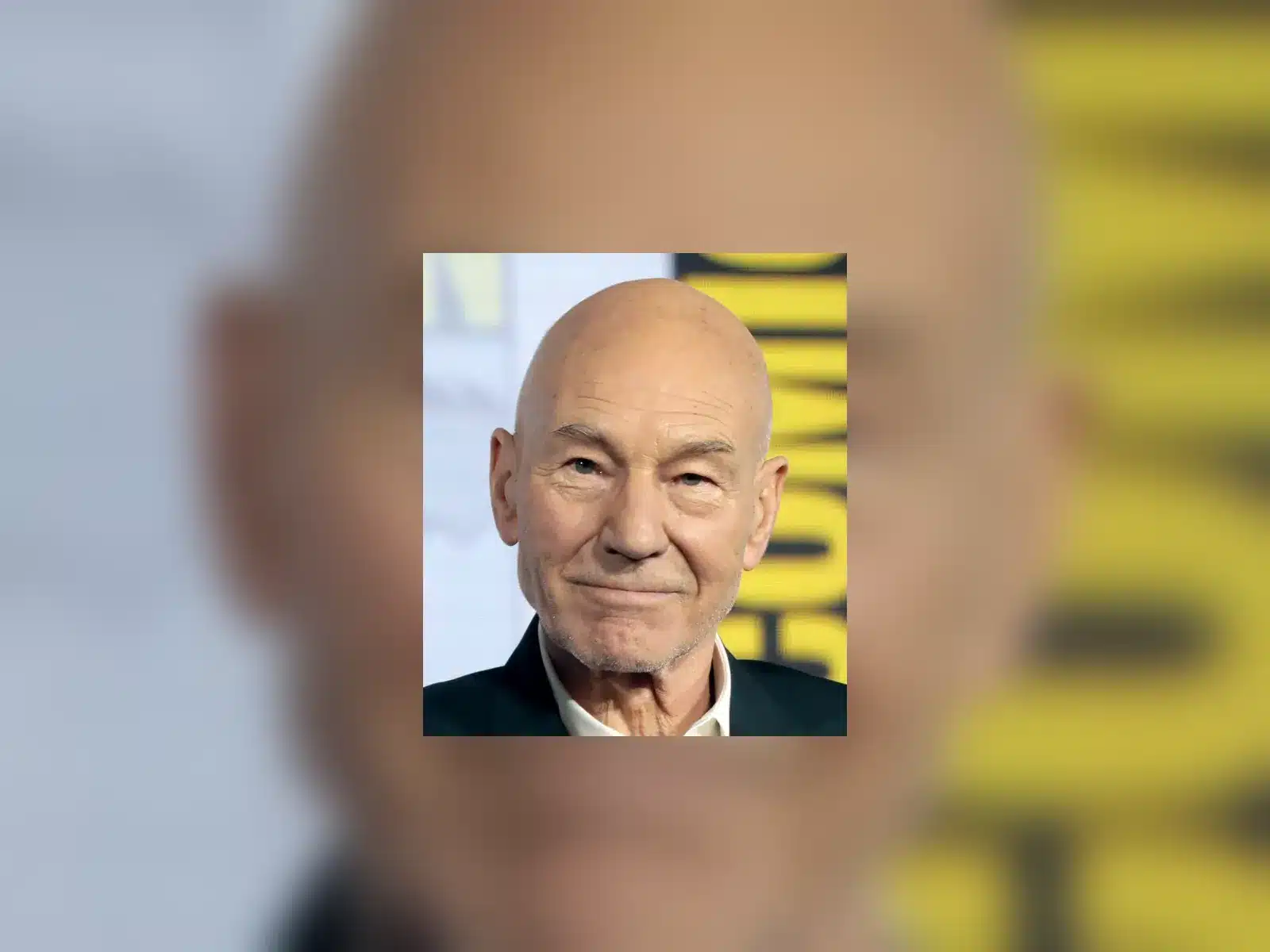 Sir Patrick Stewart smiling at the 2019 San Diego Comic-Con Star Trek: Picard panel.