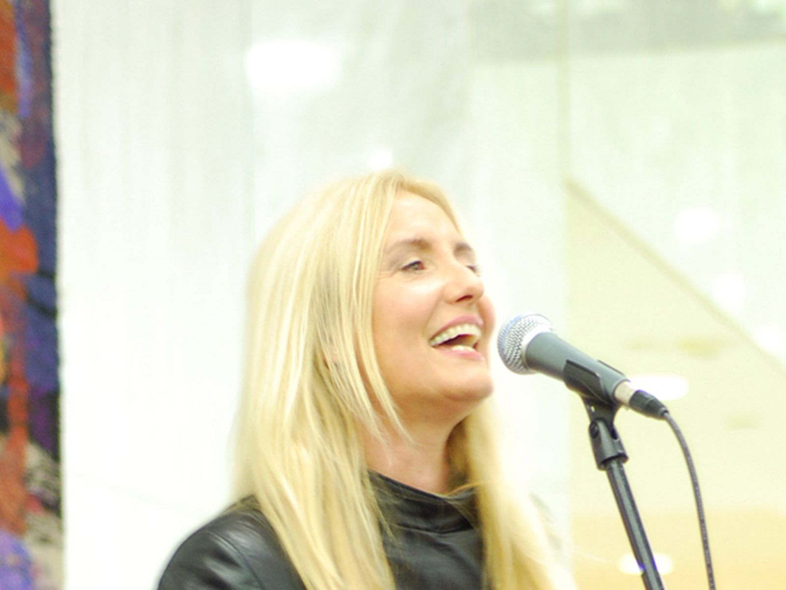 Sass Jordan smiling during a performance in Toronto