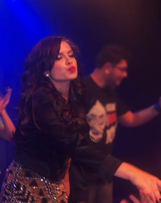 Lua Blanco performing in a stage musical
