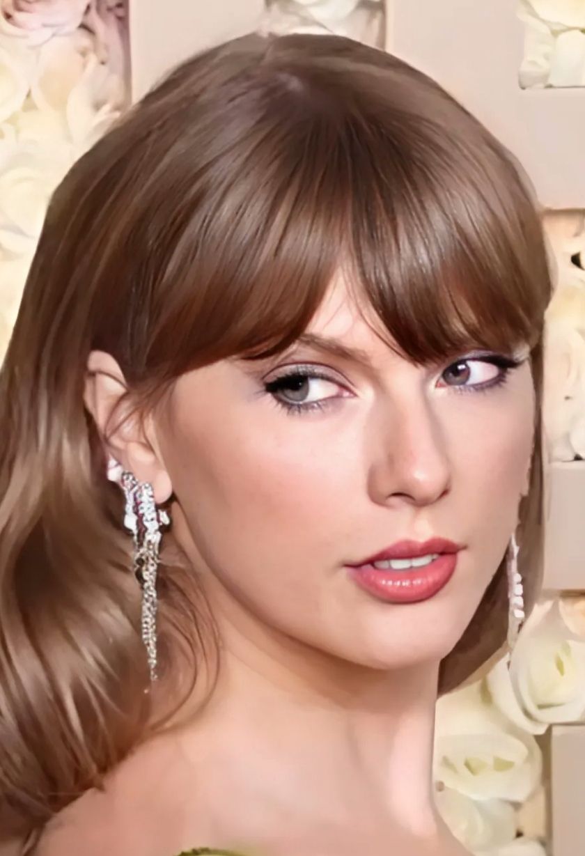 Taylor Swift performing on stage in a sparkling outfit