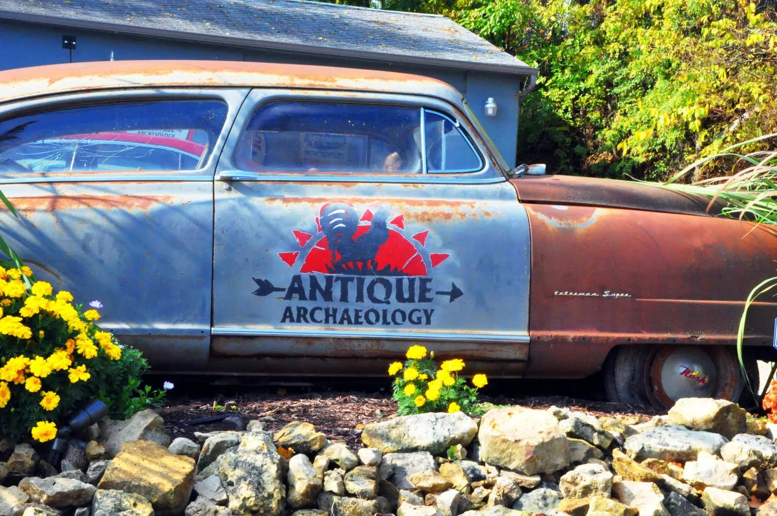 The 1950 Nash Statesman with the Antique Archaeology logo parked outside Mike Wolfe's shop