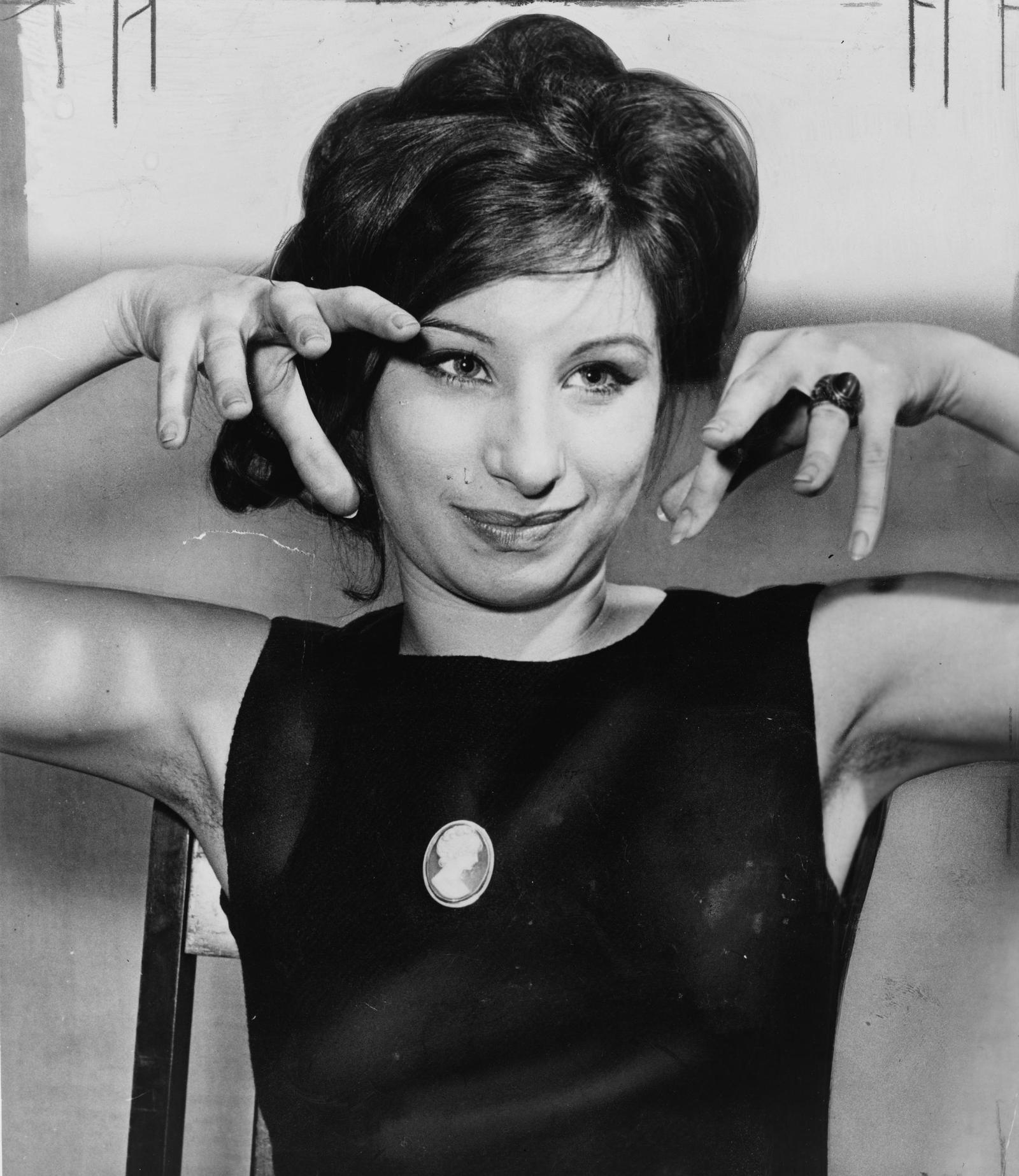 Barbra Streisand photographed in 1962, early in the career that produced iconic red carpet looks by decade