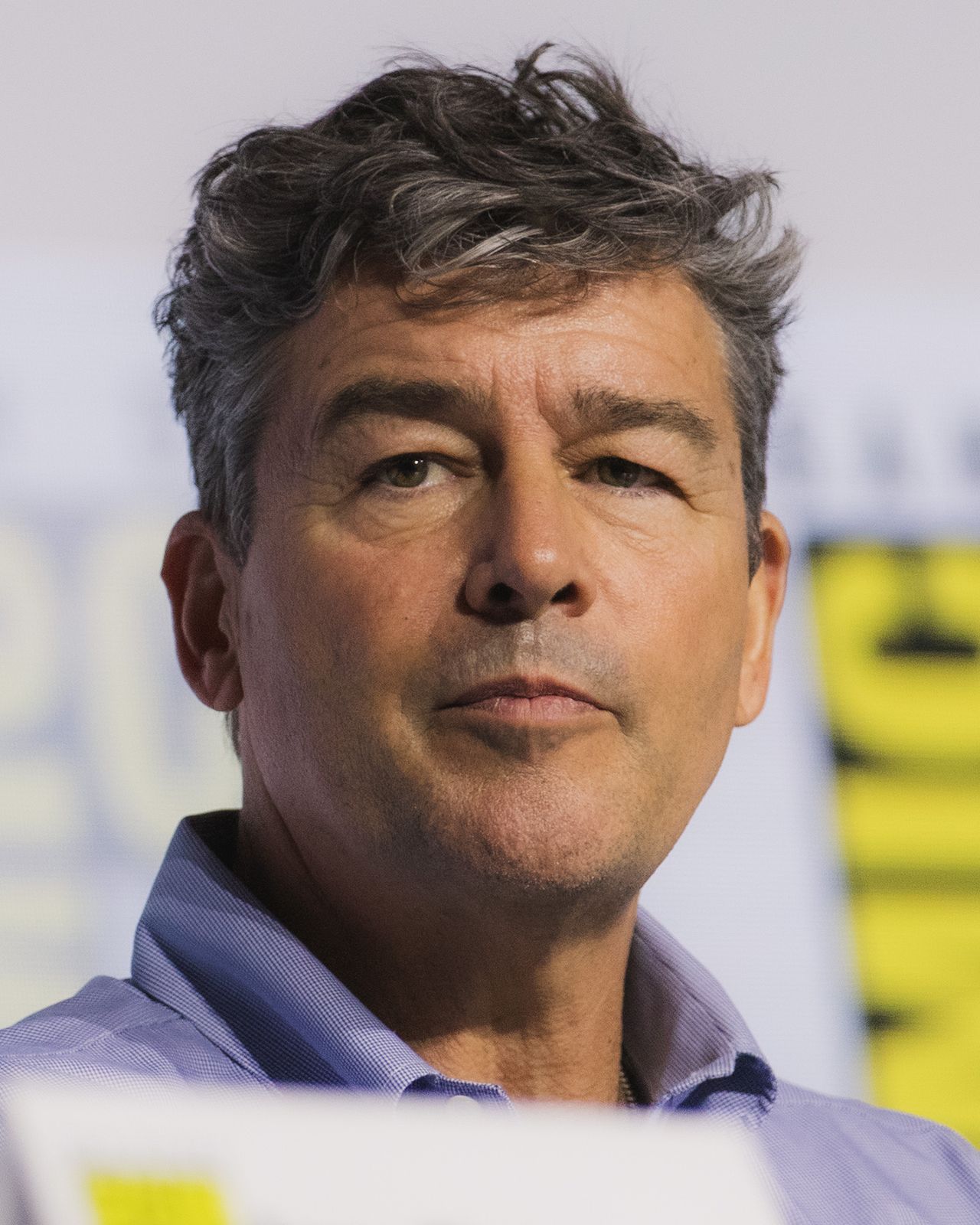 Kyle Chandler smiling at the Lanterns panel at San Diego Comic-Con 2026