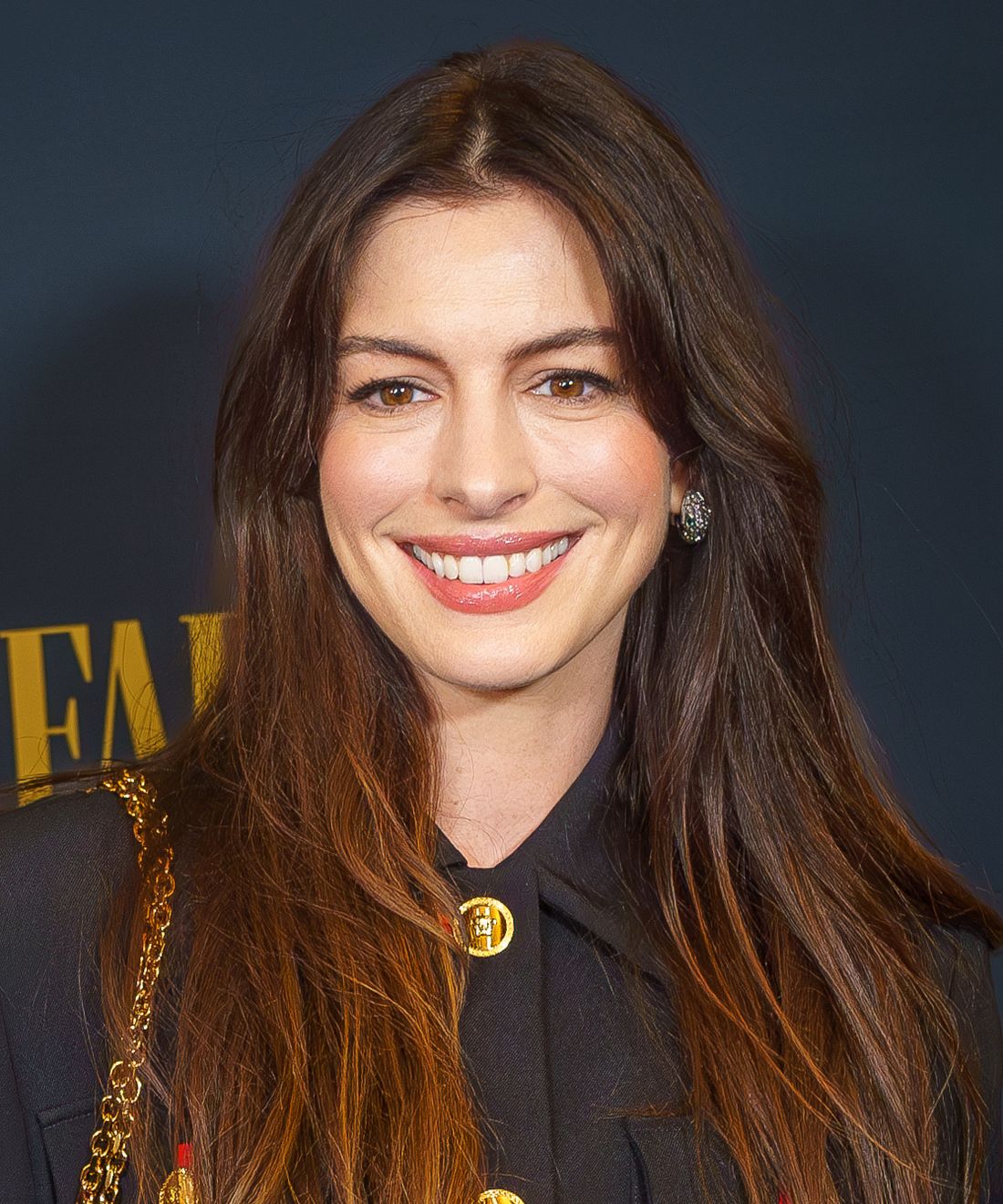 Anne Hathaway smiling in New York City in 2024