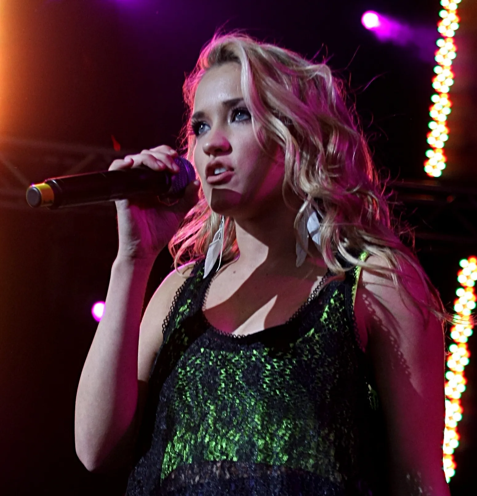 Emily Osment posing for a portrait in 2010