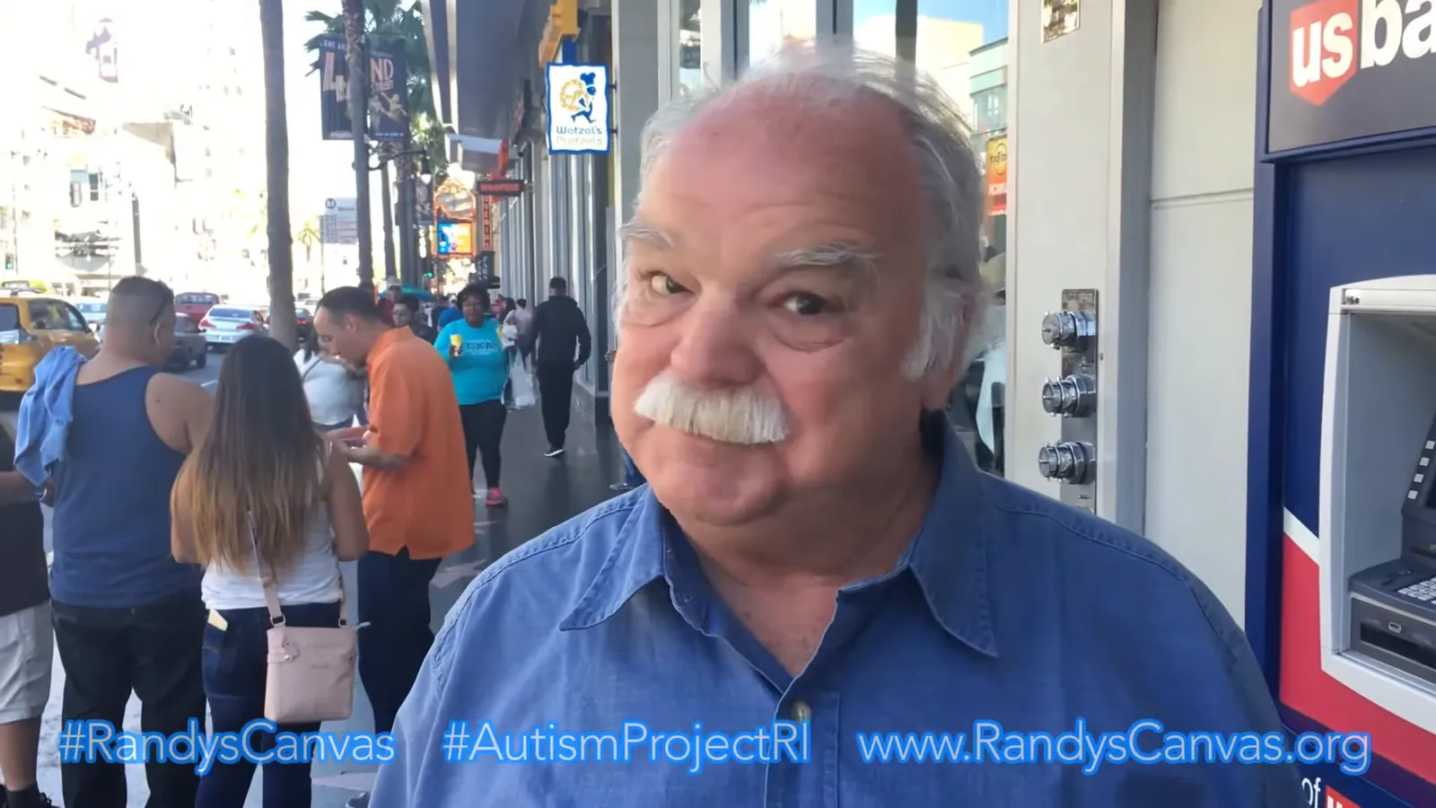 Richard Riehle smiling at the camera on Hollywood Boulevard during a 2016 autism awareness fundraiser