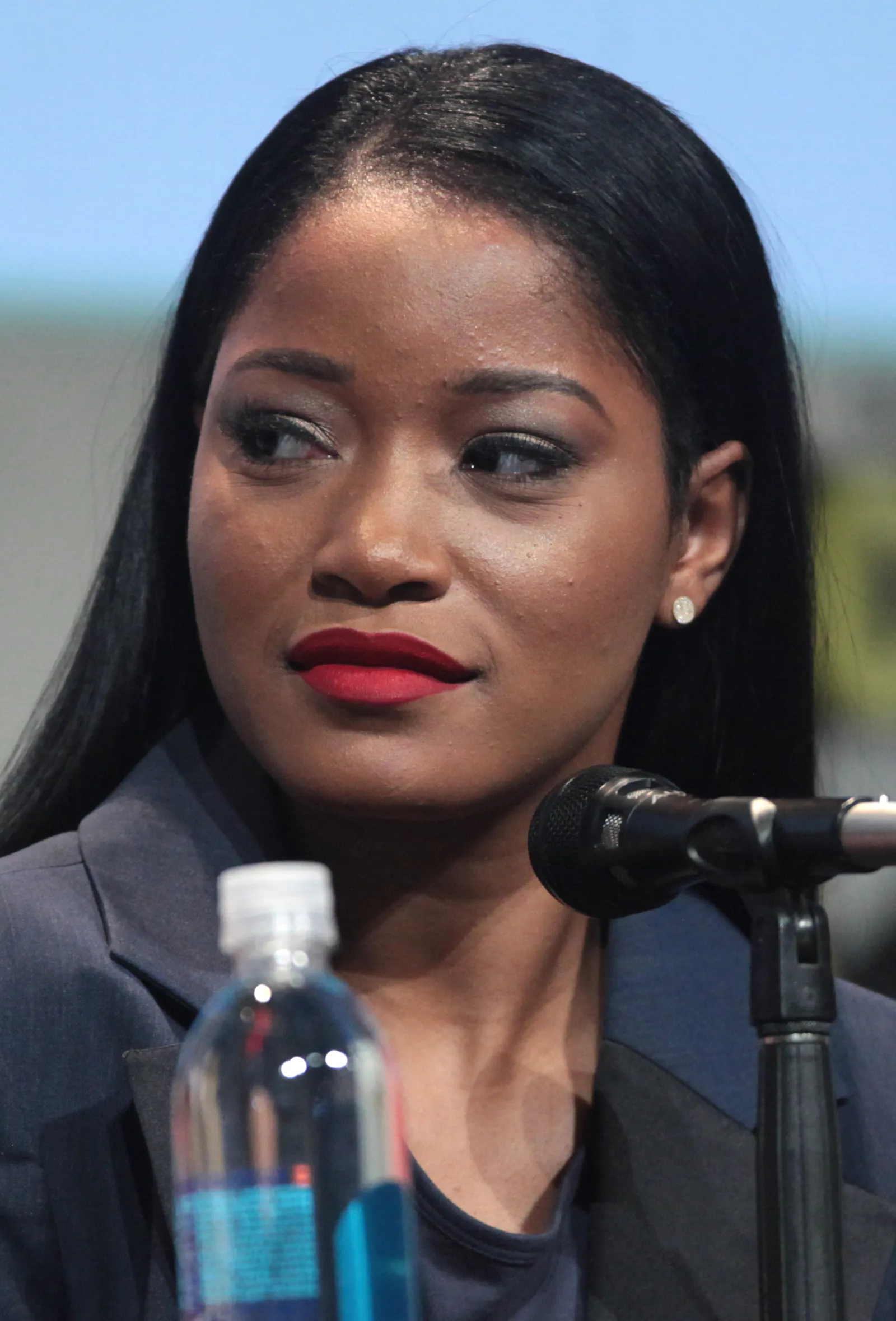 Keke Palmer smiling at a Comic-Con panel, photographed by Gage Skidmore