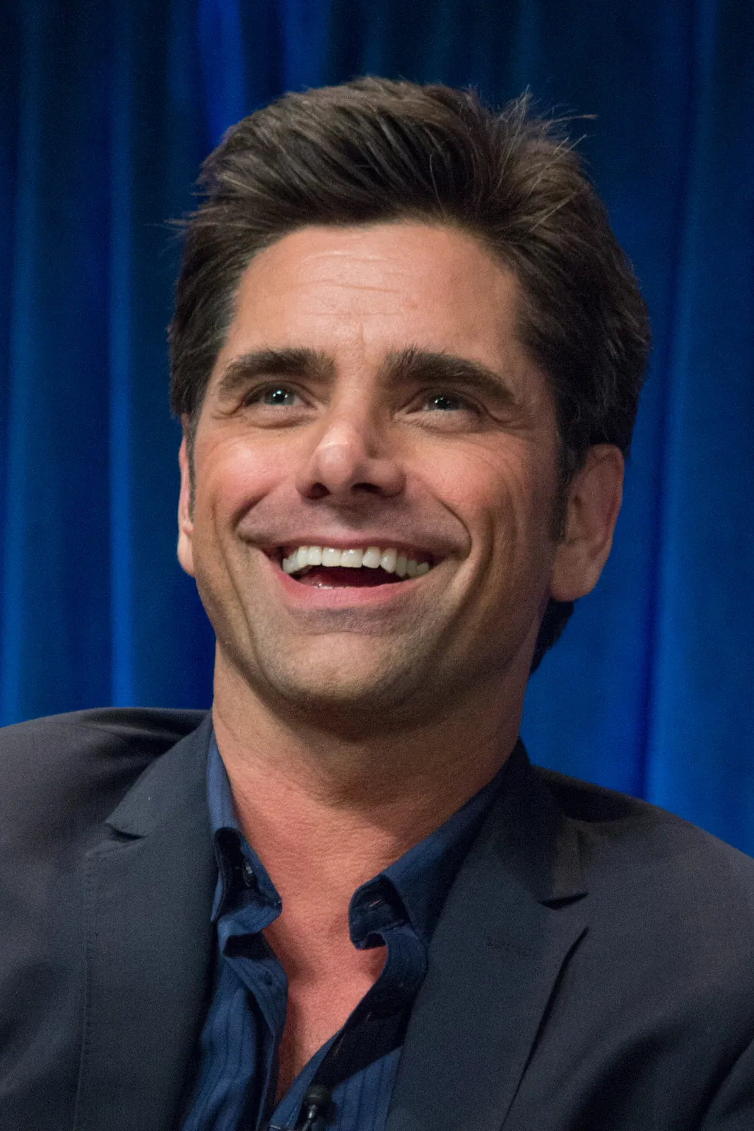 John Stamos smiling at PaleyFest 2013
