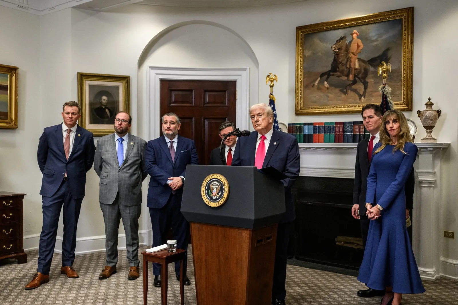 Susan Dell in the Oval Office during the Trump Accounts event, standing beside President Trump at the podium.