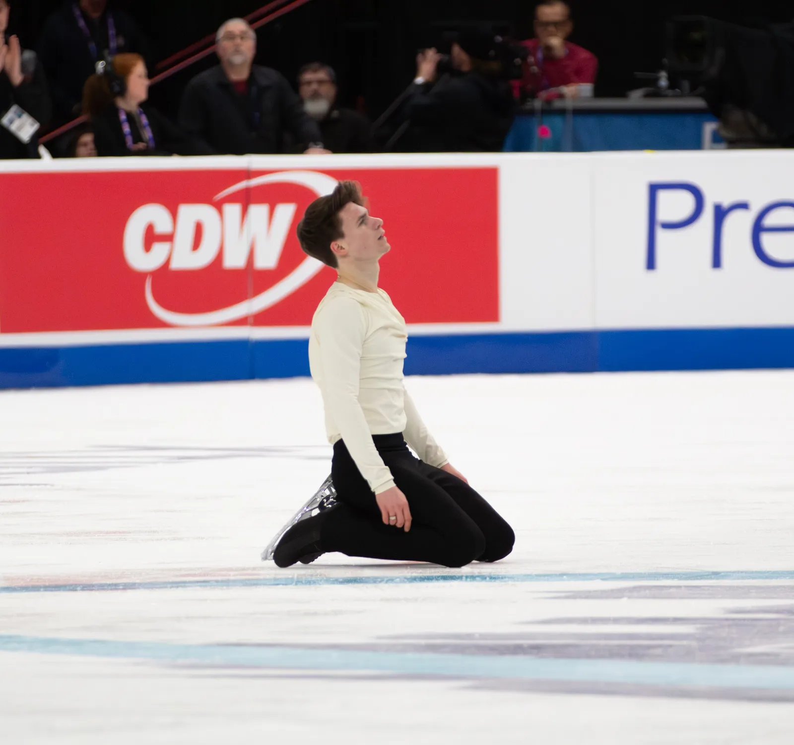Maxim Naumov kneeling on the ice during his short program at the 2026 U.S. Figure Skating Championships