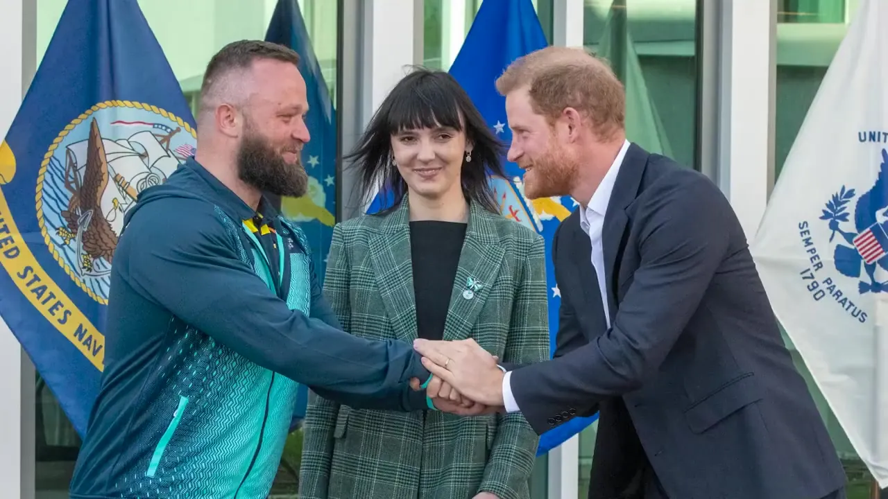 Prince Harry greeting Invictus Games athletes and shaking hands at a welcome event