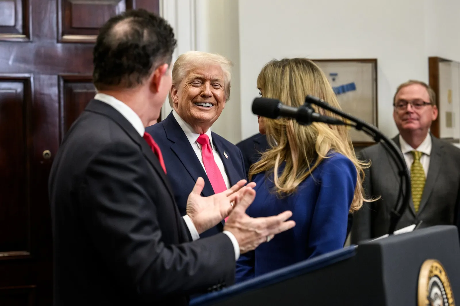 President Trump laughing with Michael and Susan Dell at the White House Trump Accounts announcement.