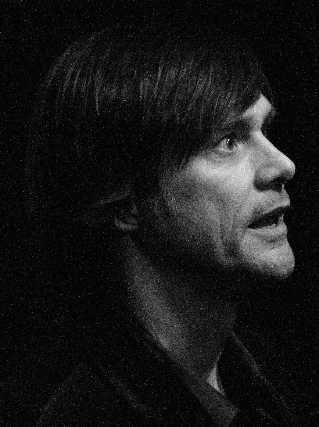 Black-and-white portrait of Jim Carrey in profile at an event in 2010