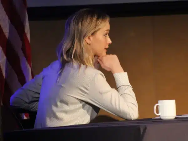 Jennifer Lawrence seated at a panel in 2018