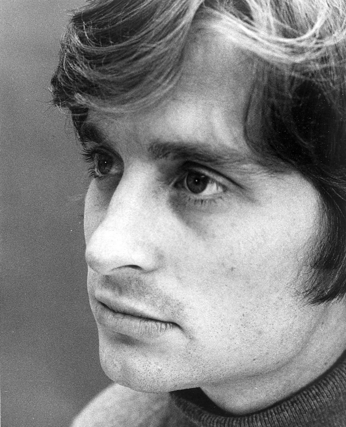 A young Michael Douglas in a black-and-white 1969 publicity portrait