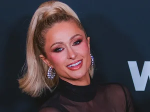 Paris Hilton smiling at the WWD Style Awards 2026 red carpet