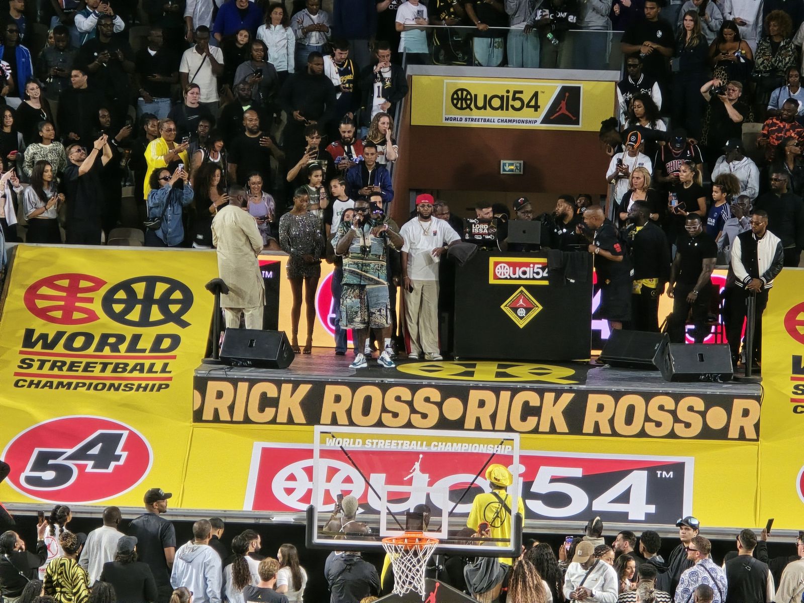 Rick Ross performing on stage at a concert