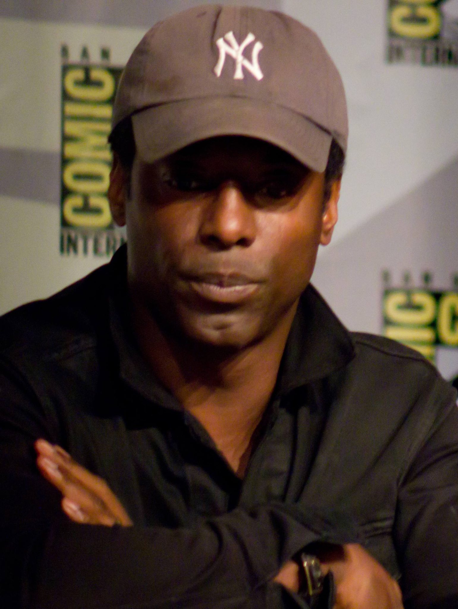 Close-up of Isaiah Washington wearing a baseball cap at San Diego Comic-Con 2013
