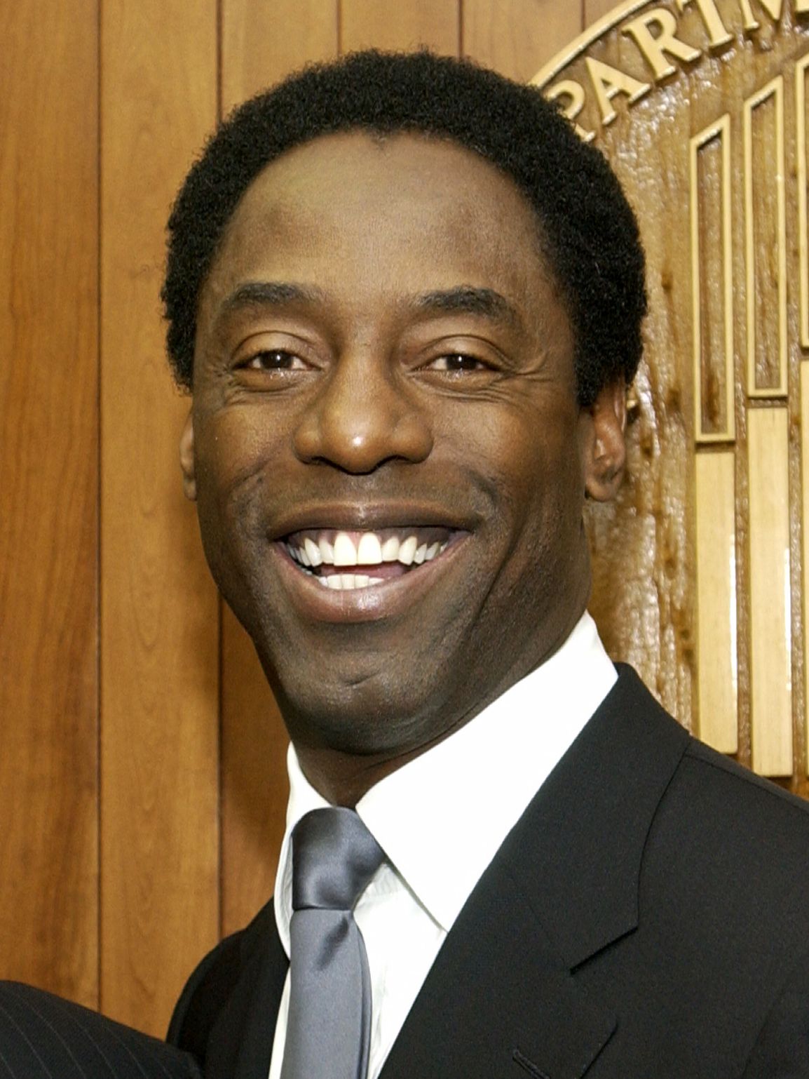Isaiah Washington smiling in a 2004 portrait photo
