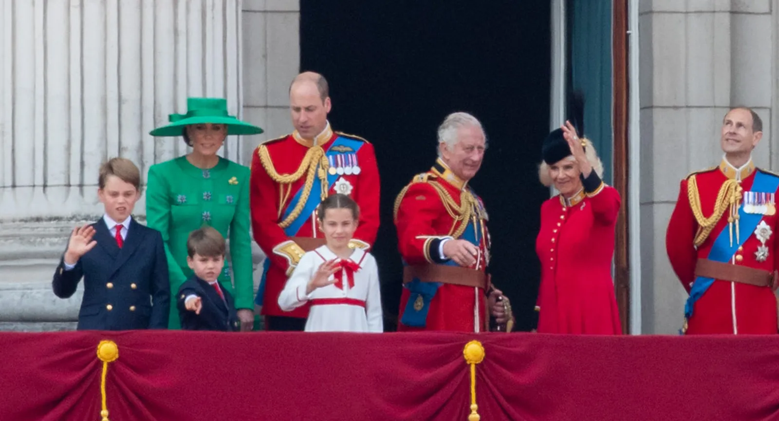 Princess Charlotte of Wales waving from the Buckingham Palace balcony during Trooping the Colour 2023, with Prince William, Catherine Princess of Wales, and King Charles III