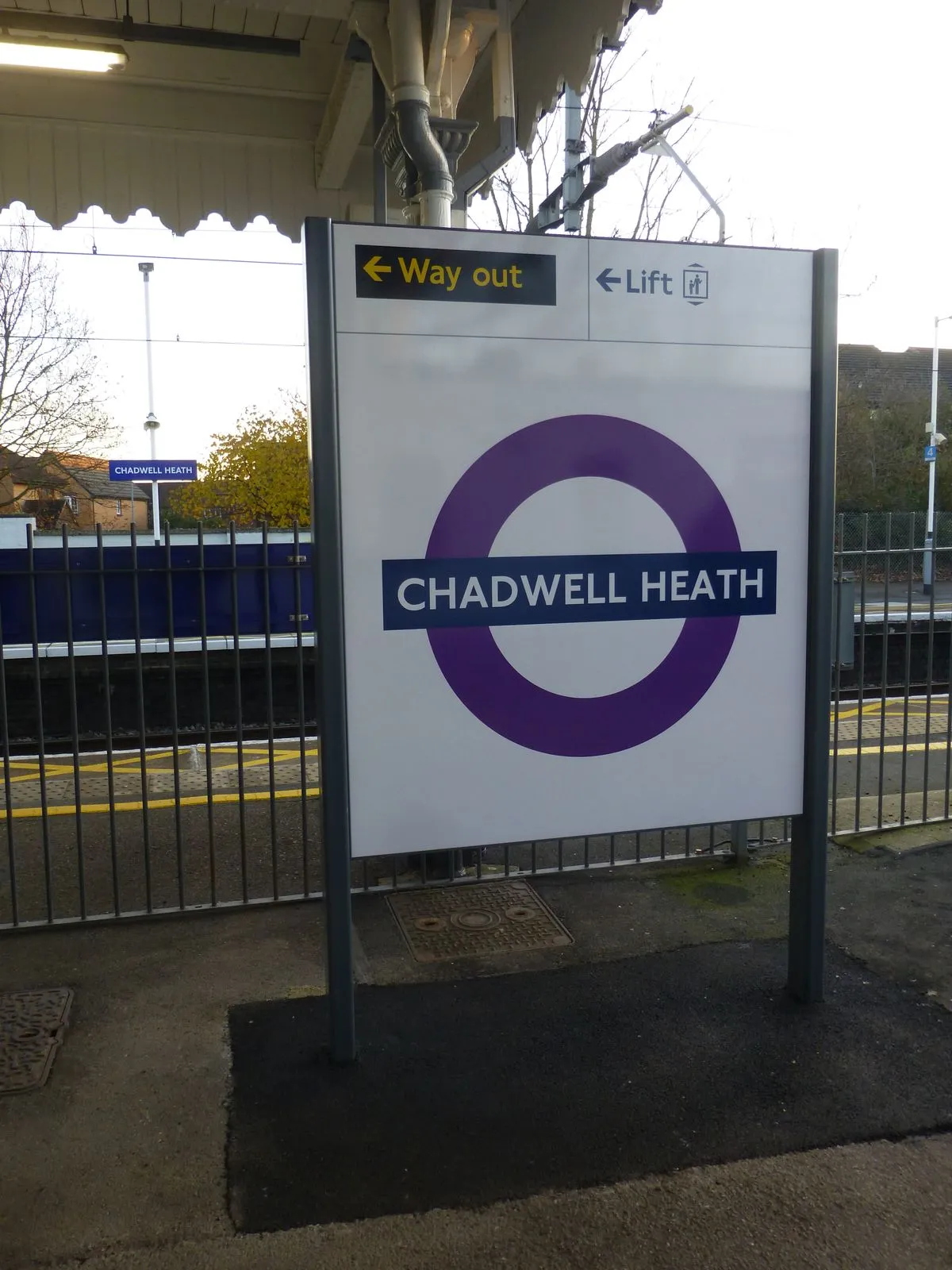 Elizabeth Line roundel signage being installed at Chadwell Heath station