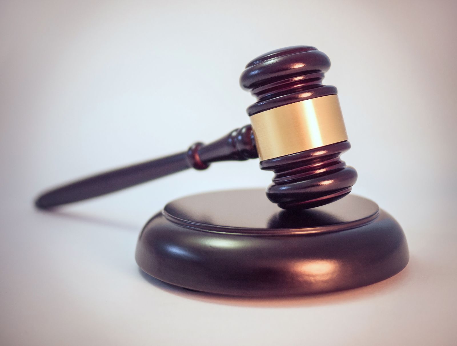Judge's gavel on a sound block in a courtroom