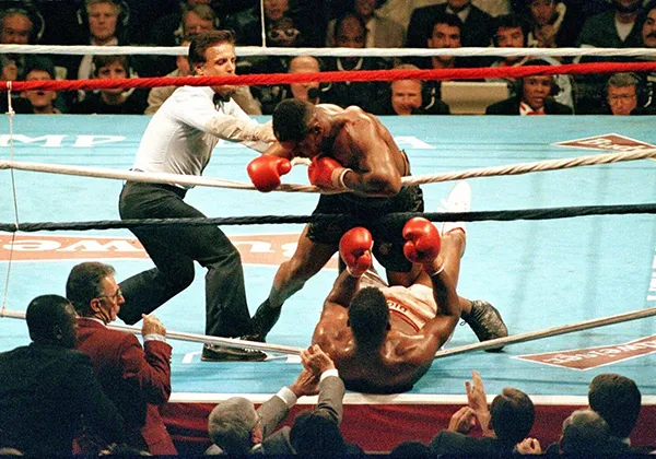 Mike Tyson knocks out Tyrell Biggs during their 1987 heavyweight title fight