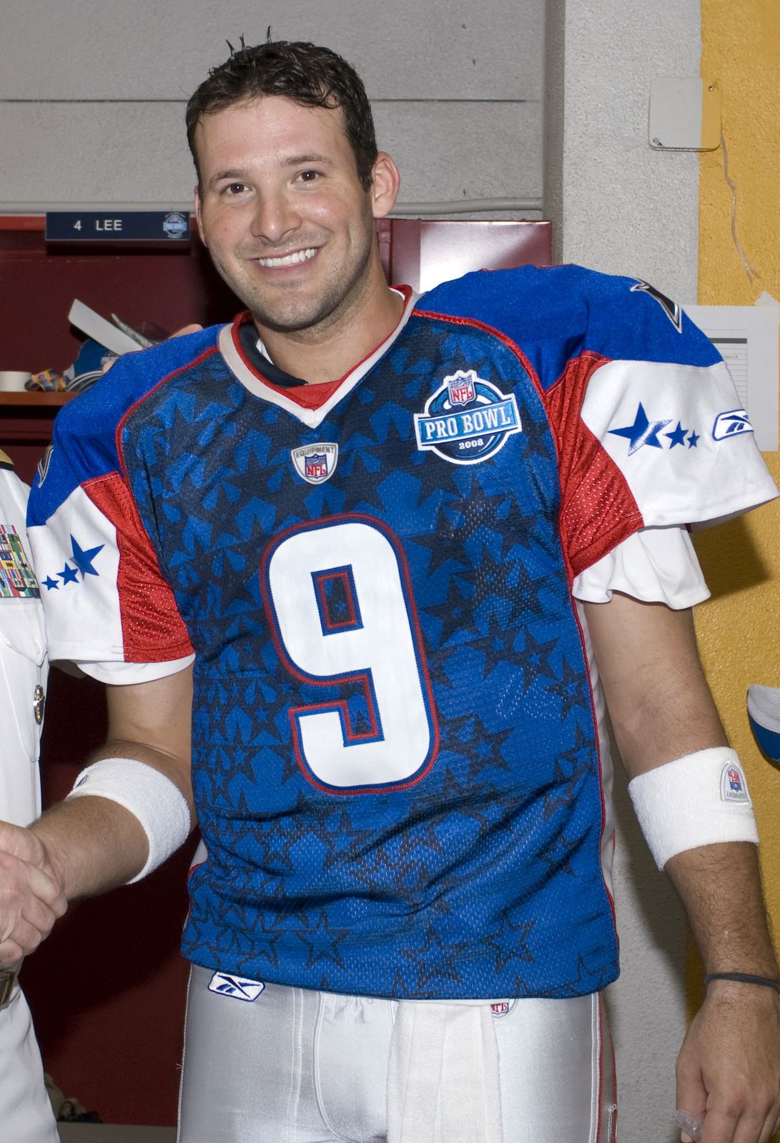 Tony Romo smiling in his 2008 Pro Bowl jersey before the game
