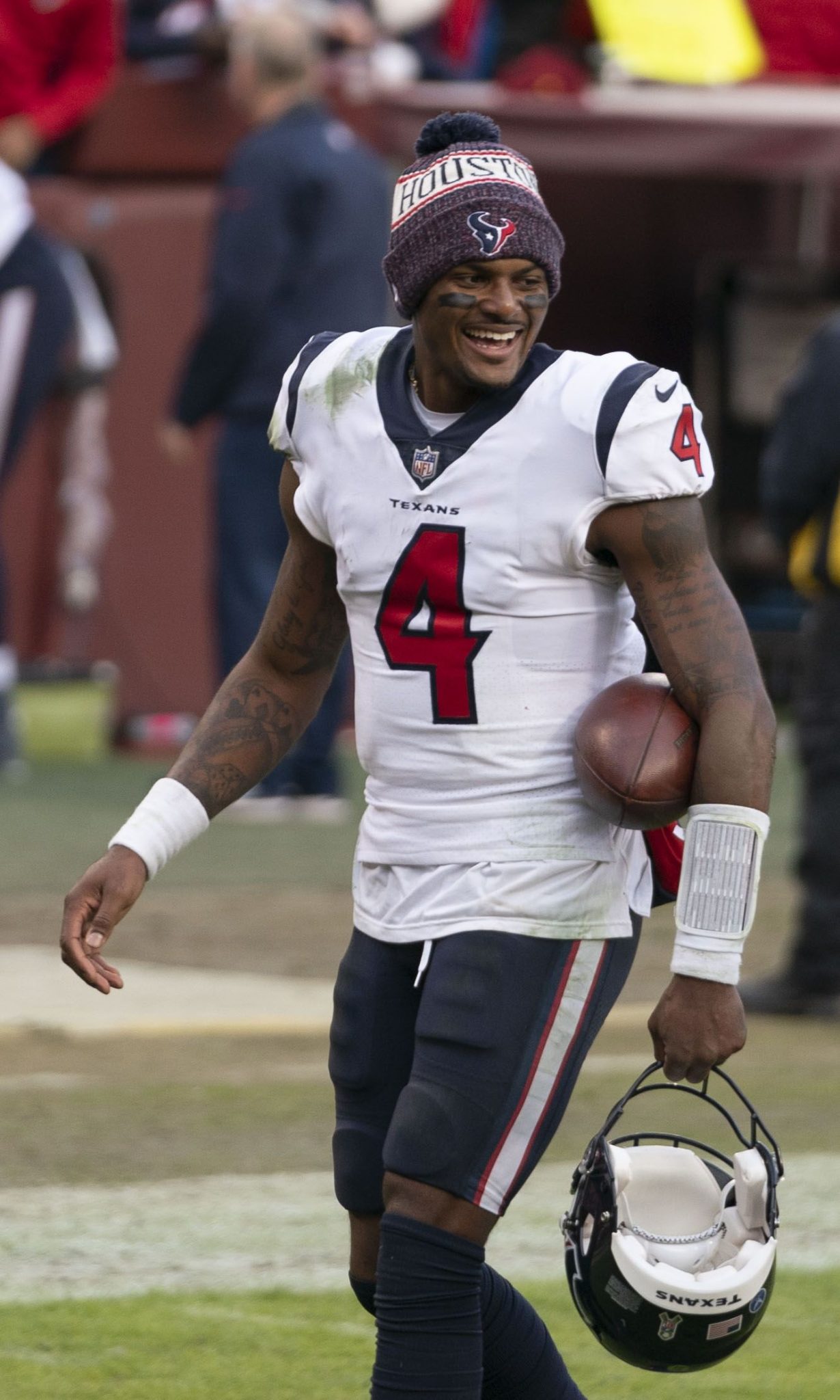 Deshaun Watson walking off the field in a Texans uniform and beanie in 2018