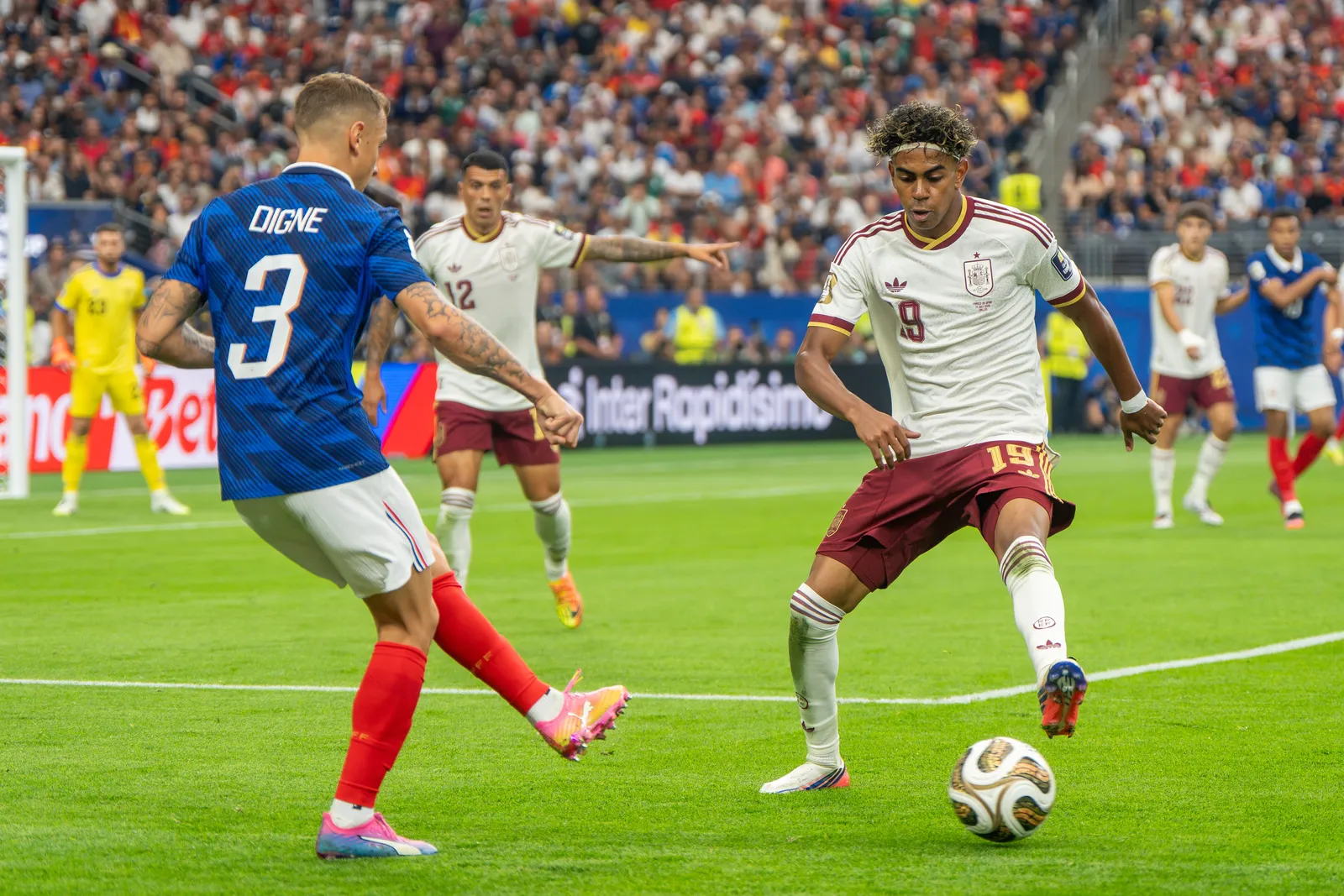 Lamine Yamal with the ball against France's Lucas Digne at the 2026 FIFA World Cup